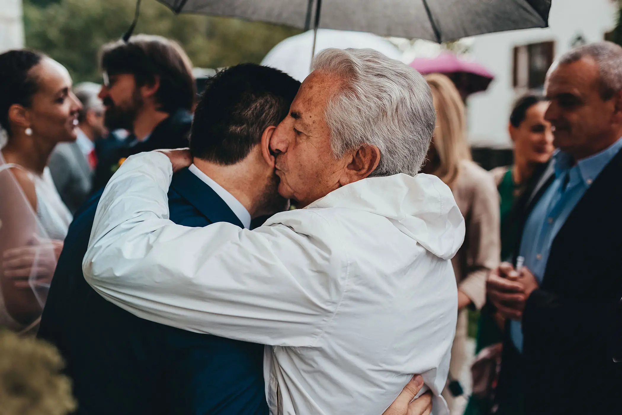 uncle of the groom hugging the groom